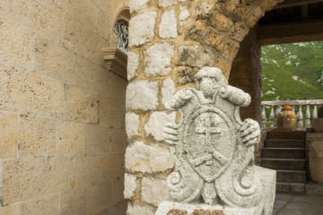 Some view of the island of The church Our Lady of the Rocks (Gospa od Skrpjela) and its architectural dcor near Perast in the Bay of Kotor (Boka Kotorska), Montenegro 