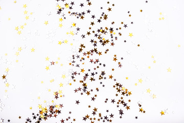 Golden and silver stars on white background.