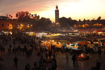 Fototapeta na wymiar Marrakech, Morocco »; Spring 2017: Colorful sunset of the night market in Marrakech square from a terrace