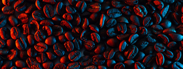 a scattering of coffee beans for the background illuminated with neon