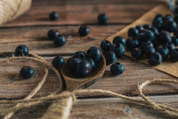 Tasty bilberry on wooden surface