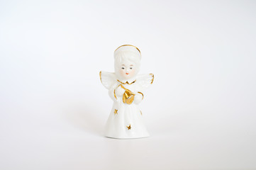 Ceramic angel figurine on a white background