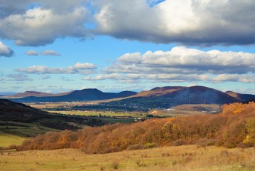 the shadow of the clouds on the hills