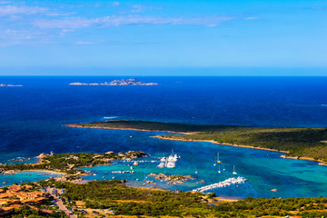 panoramic view of the gulf of marinella during a sunny summer day with the island of mortorio in the distance, Sardinia, Italy - 305542399