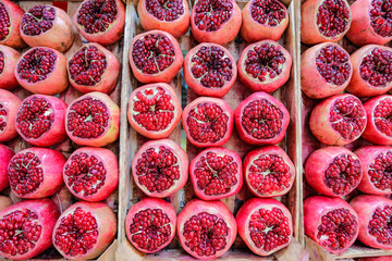 Pomegranate background. Many Pomegranate cut in half.