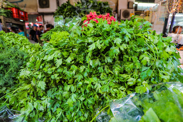 Collection of fresh fine herbs and green leaves on market. Bunch of herbs.