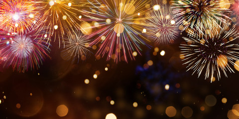 Colorful firework with bokeh background. New Year celebration.