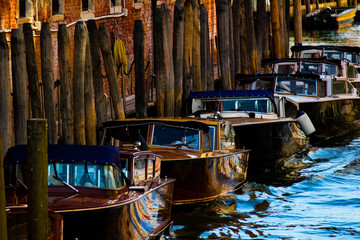 Fototapeta na wymiar taxi boats docked along the Grand Canal of Venice, Italy