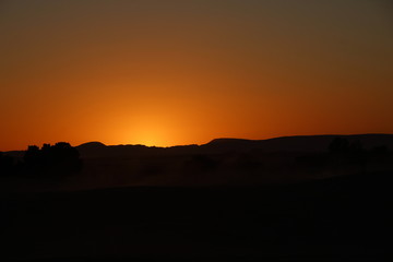 Last lights from the Berber camp of the Merzouga desert in the Erg Chebbi Dunes. Morocco