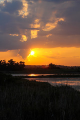 sunset over the saline in the nature reserve of vendicari in Sicily, Italy