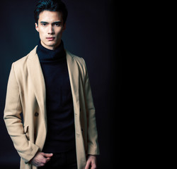handsome asian fashion looking man posing in studio on black background, lifestyle modern people concept