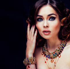 beauty rich woman with bright makeup wearing luxury jewellery on black background, fashion lady...
