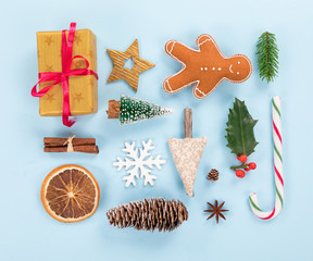 Christmas decorations on pastel color background. Top-down view.