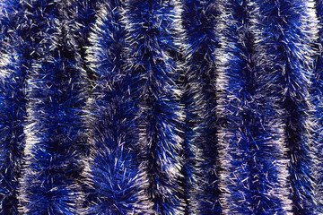 Christmas tinsel of blue color.