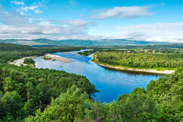 Altaelva river in Norwegian Finnmark as seen from Kaiskuru locality in the direction of Alta town. - obrazy, fototapety, plakaty