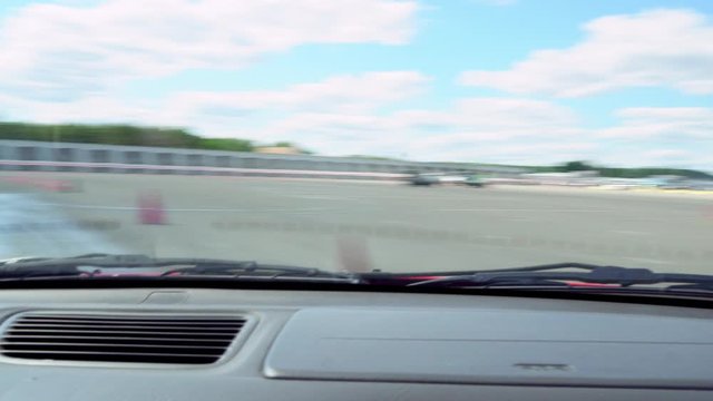 view from the car cabin on the race track, emergency driving car in autodrome, police cars at the autodrome, asphalt autodrome with road markings driving exam, police turn at the autodrome