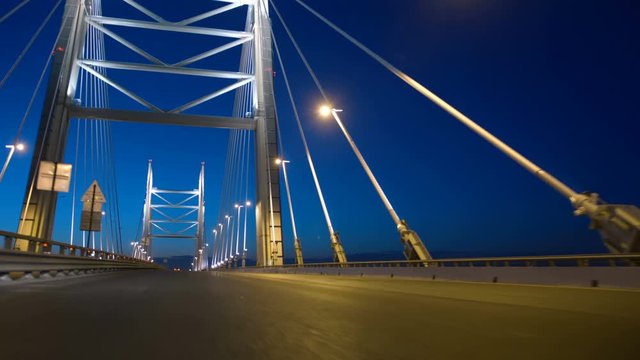New stylish expressway Western Speed Diameter in St. Petersburg at night, the Big Cable-stayed Bridge impresses with its size and beauty