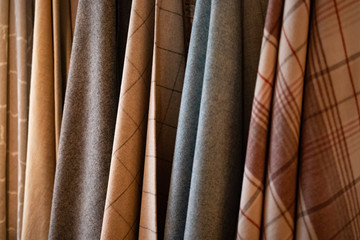 Obraz premium Tie-dyed fabrics from natural colors, hung on a clothesline arranged in rows. Wool