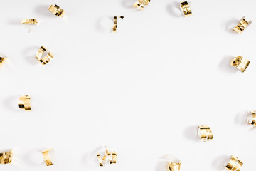 Christmas holiday composition. Golden decorations on white background. Christmas, New Year, winter concept. Flat lay, top view, copy space