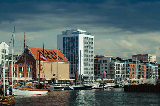 The Panorama view to Gdansk river bank with the yacht and buildings