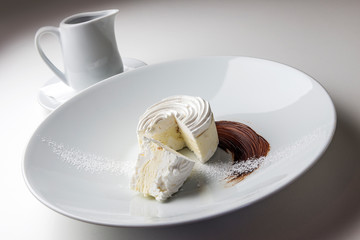Meringue dessert with chocolate sauce