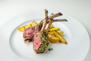 Rack of lamb with herbs and roast potatoes