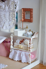 Fototapeta na wymiar Doll bathroom, miniature sink with mirror