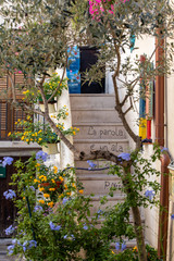Fototapeta na wymiar Romantic and evocative poems written on the walls and stairs of houses in Polignano a Mare. Apulia, Bari province, Italy,