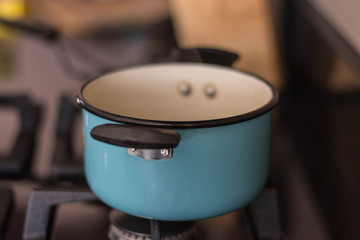 small blue pot on the stove