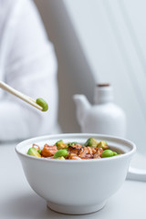 Chirashi Sushi Rice Bowl. Japanese Appetizer with Burnt Salmon, Edamame Soybeans, Avocado and Rice