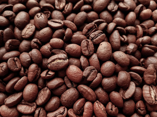 Fragrant roasted coffee bean. Dark background concept.
