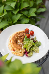 Tomato Omelette with Lettuce Salad. Breakfast in Garden