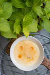 Creamy Rice Pudding with Apricot Jam and Almond Crumb. Breakfast in Garden