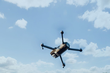 drone quad copter with high resolution digital camera on the sky