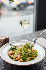Green Tagliatelle Pasta with Spinach, Prawns and Chicken. Modern Cafe Lunch