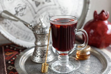 Warm Pomegranate Mulled Wine with Honey. Winter Beverage.