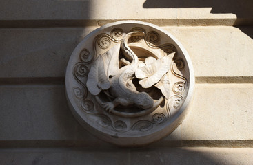 Carved Roundel on Stone Wall in Part Shadow 3419-039