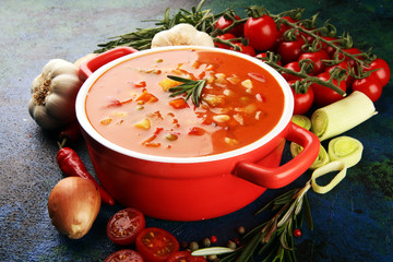 Minestrone soup in a bowl on a light table, top view. Italian soup with pasta and seasonal vegetables. Delicious vegetarian food concept.