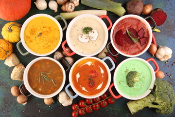 Variety of colorful vegetables cream soups and ingredients for soup. Concept of healthy eating or vegetarian food with mushrooms