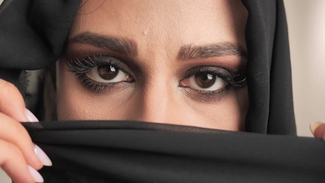Close up portrait Eyes of arab woman in a burqa 4k