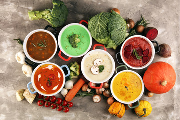 Variety of colorful vegetables cream soups and ingredients for soup. Concept of healthy eating or vegetarian food with mushrooms