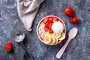 Oatmeal with strawberry, banana and ice cream
