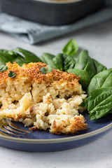 Mac and cheese, American style macaroni pasta with cheesy bechamel sauce and crunchy breadcrumbs topping. Pasta and cheese casserole.