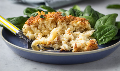 Mac and cheese, American style macaroni pasta with cheesy bechamel sauce and crunchy breadcrumbs topping. Pasta and cheese casserole.
