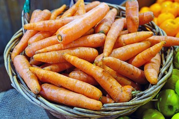 Fresh orange carrots for sale at a farmers market