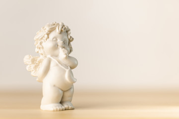 plaster figurine of a little angel with a place for inscription