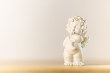 plaster figurine of a little angel with a place for inscription