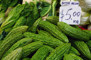 Goya bitter melon (momordica charantia) for sale at a market in Melbourne, Australia