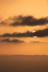 Image of the sun among the clouds
