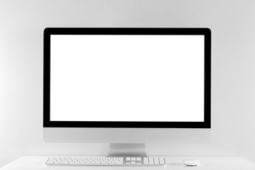 Computer all in one in office table with isolated white screen